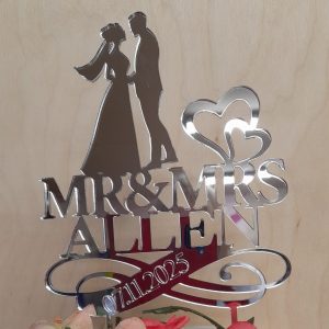 BRIDE AND GROOM ON SWASH WITH SURNAME AND DATE CAKE TOPPER